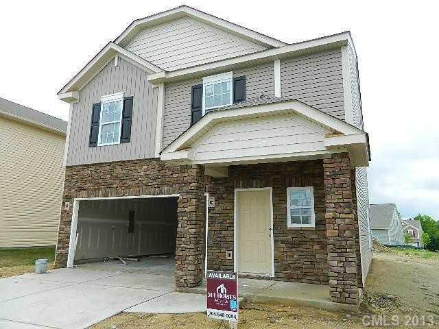 13734 Porter Creek Road Charlotte, NC 28262 - Photo 2 of 2 a front view of a house with garden