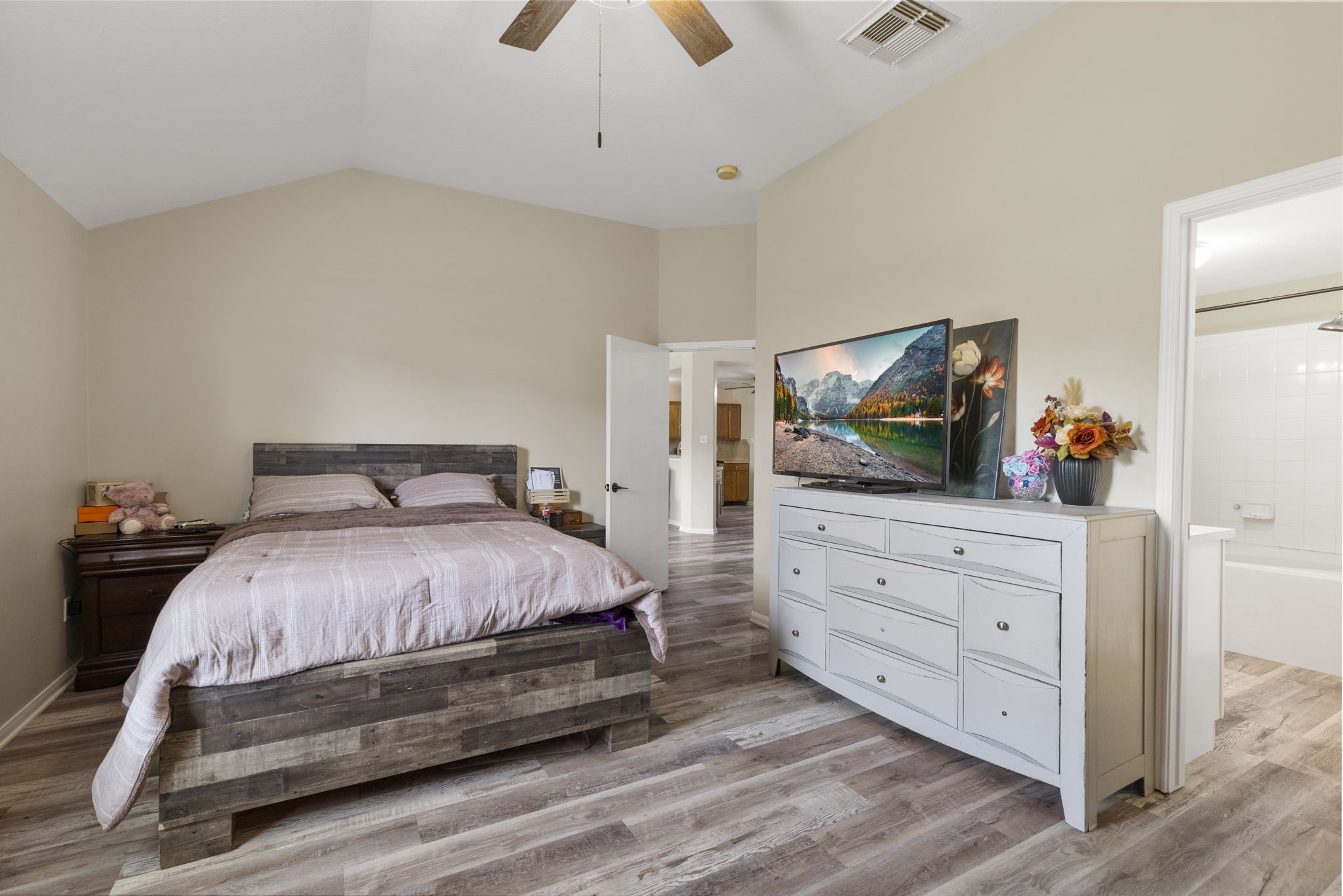 29106 Foxingham Circle Spring, TX 77386 - Photo 23 of 47 a bedroom with a bed and a flat screen tv