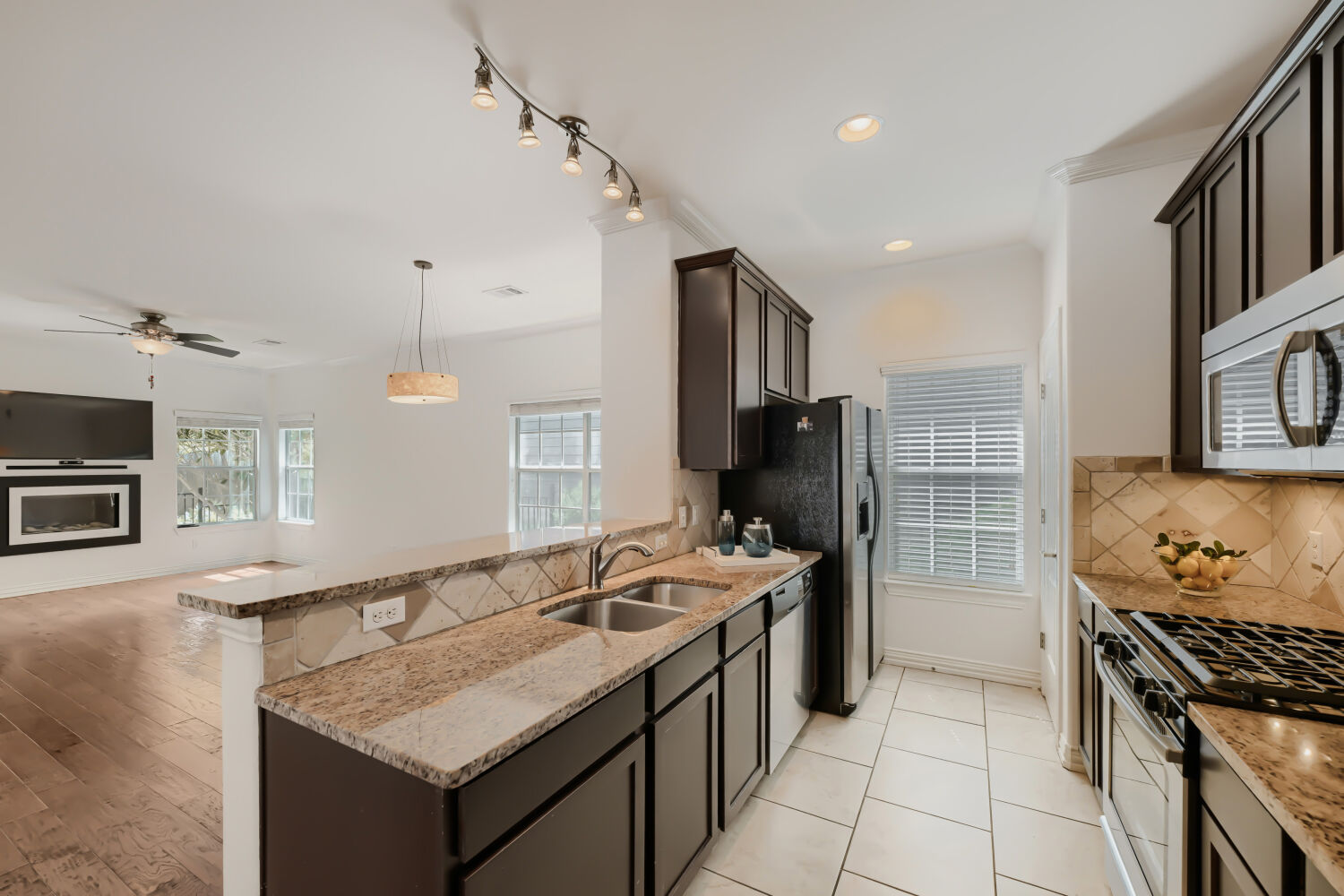6715 Windrift Way, Unit 28 Austin, TX 78745 - Photo 11 of 19 Home flows seamlessly from the kitchen and living area, perfect for entertaining.
