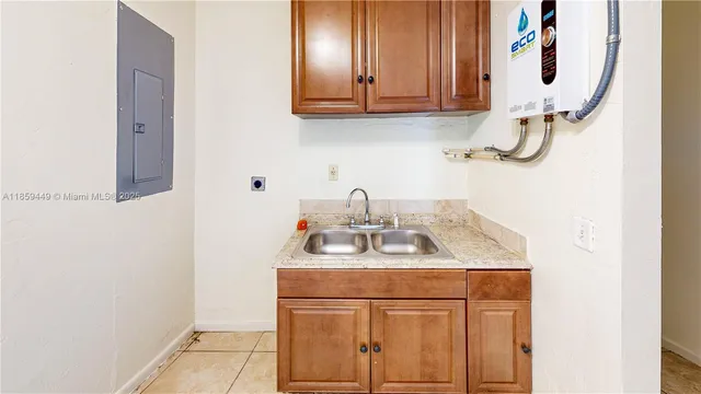 a bathroom with a sink vanity and mirror