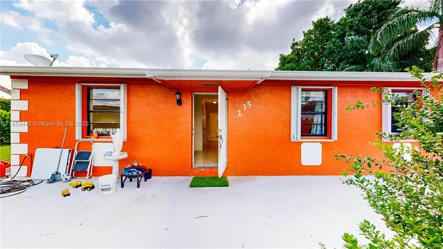 an aerial view of a house with a swimming pool