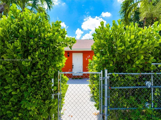 an aerial view of house with yard swimming pool and outdoor seating