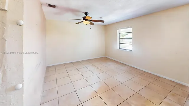 a view of an empty room and window