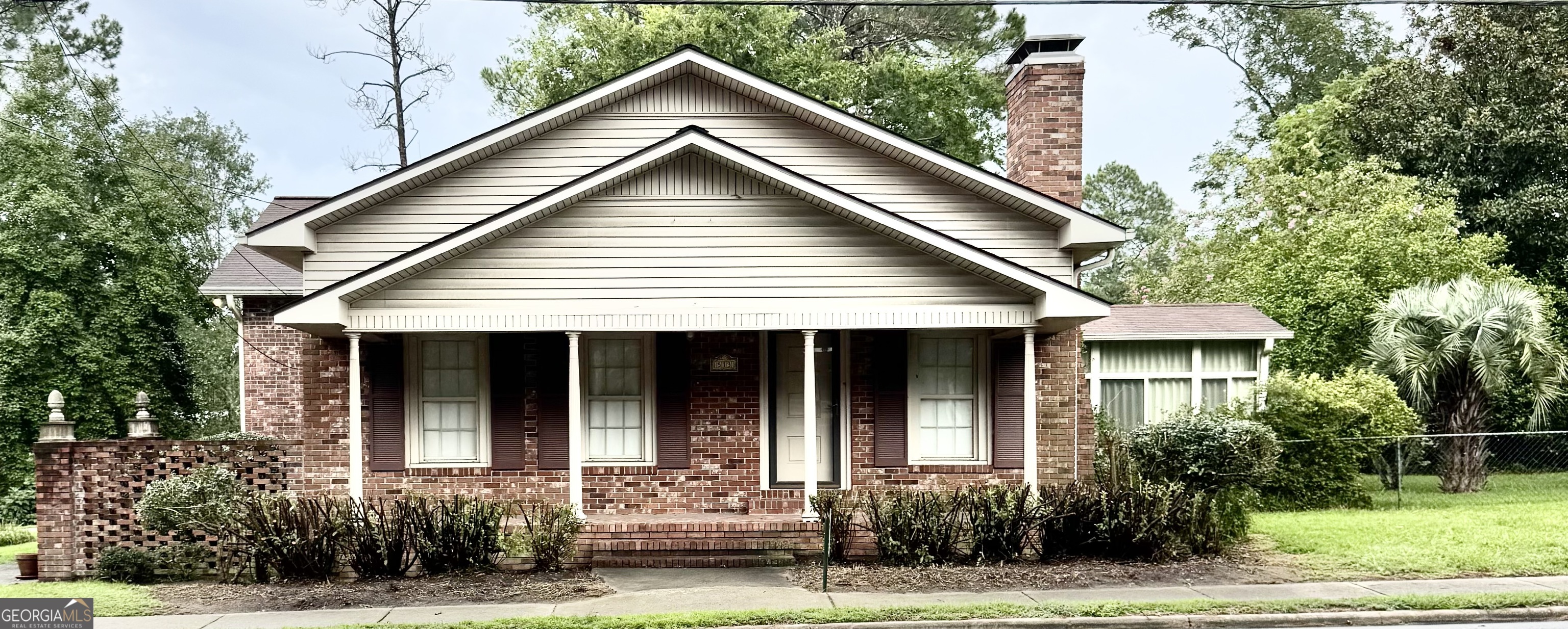 513 Main Street Collins, GA 30421 - Photo 1 of 1 a front view of a house with a yard