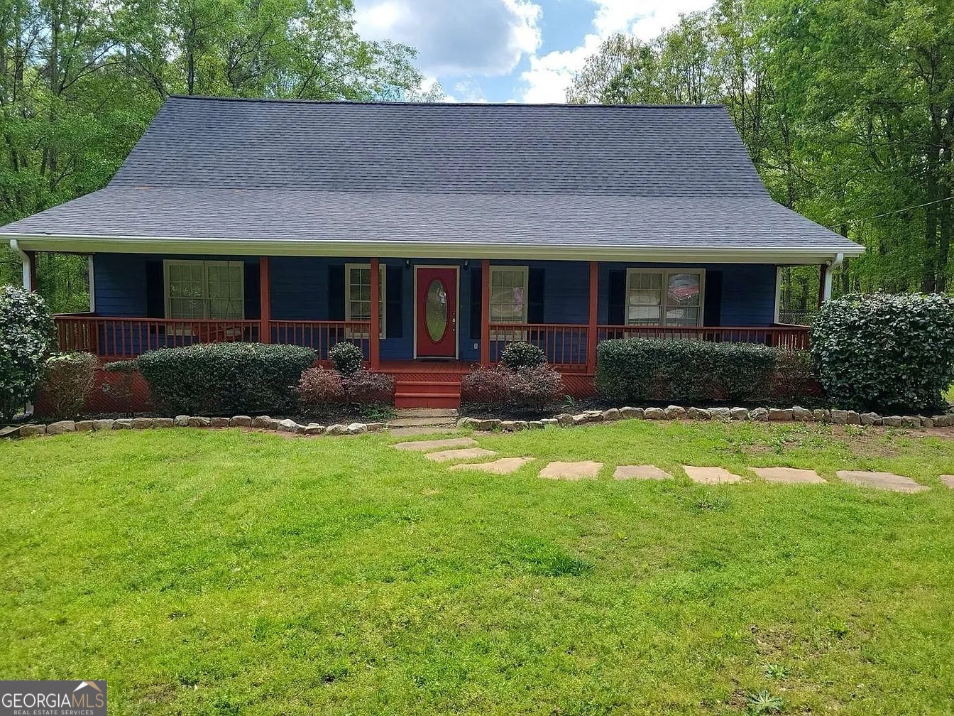 4770 Colham Ferry Road Watkinsville, GA 30677 - Photo 1 of 20 a front view of a house with a yard and porch