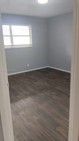 a view of a livingroom with wooden floor