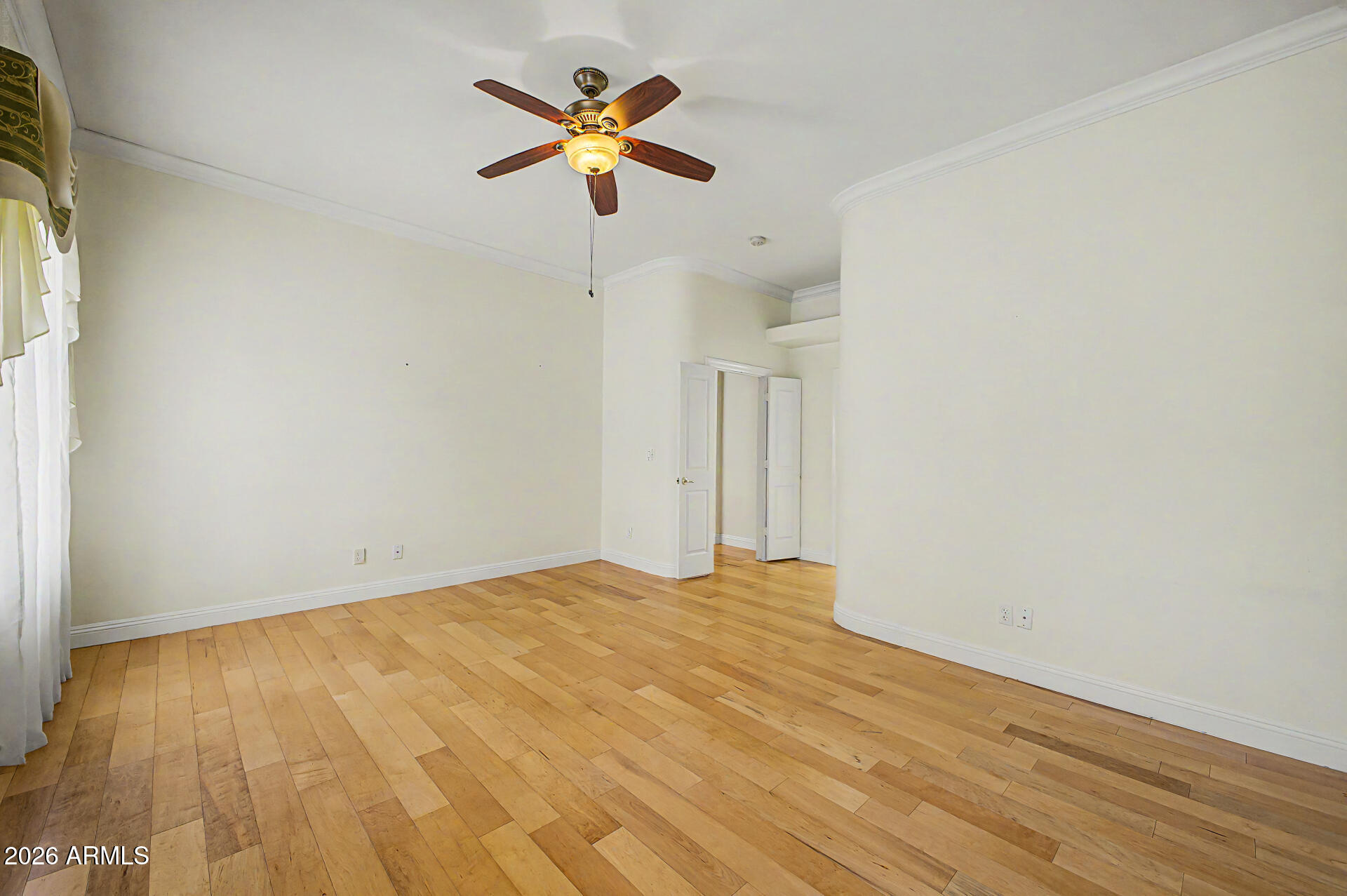 808 West Citrus Way Phoenix, AZ 85013 - Photo 16 of 35 a view of a big room with wooden floor and a ceiling fan