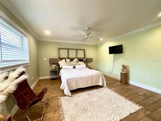 a bedroom with a bed and a couch