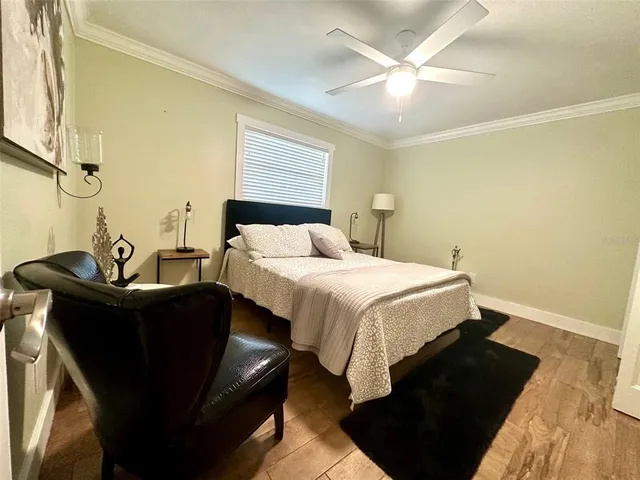a bedroom with furniture and a window