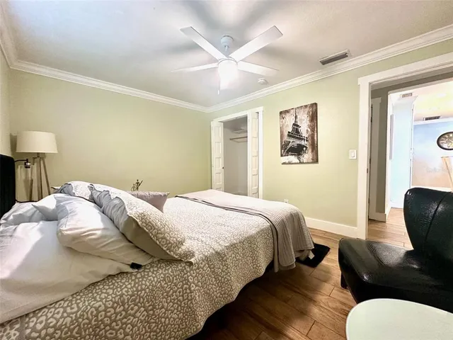 a bathroom with a granite countertop sink mirror vanity and toilet
