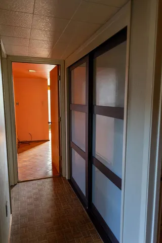 a view of an empty room with a window