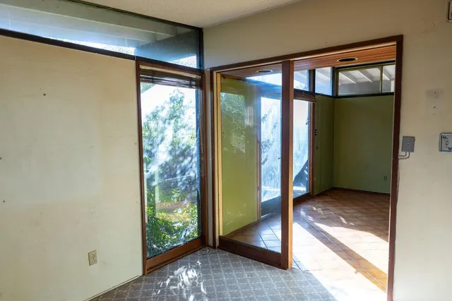 a bathroom with a toilet and shower