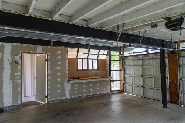 a view of an empty room with a balcony