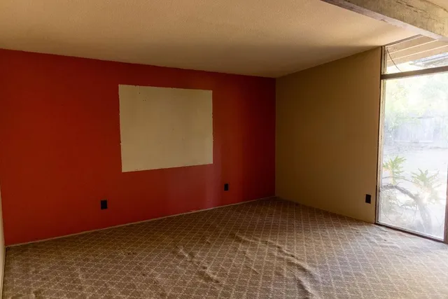 a view of an empty room and window