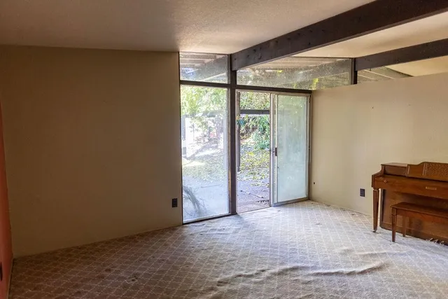 a view of an empty room with a window