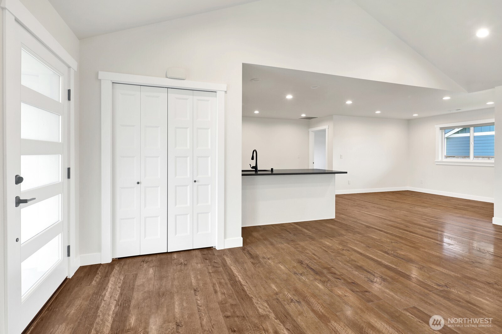 1302 Night Hawk Way Everson, WA 98247 - Photo 15 of 35 a view of an empty room with wooden floor and a window