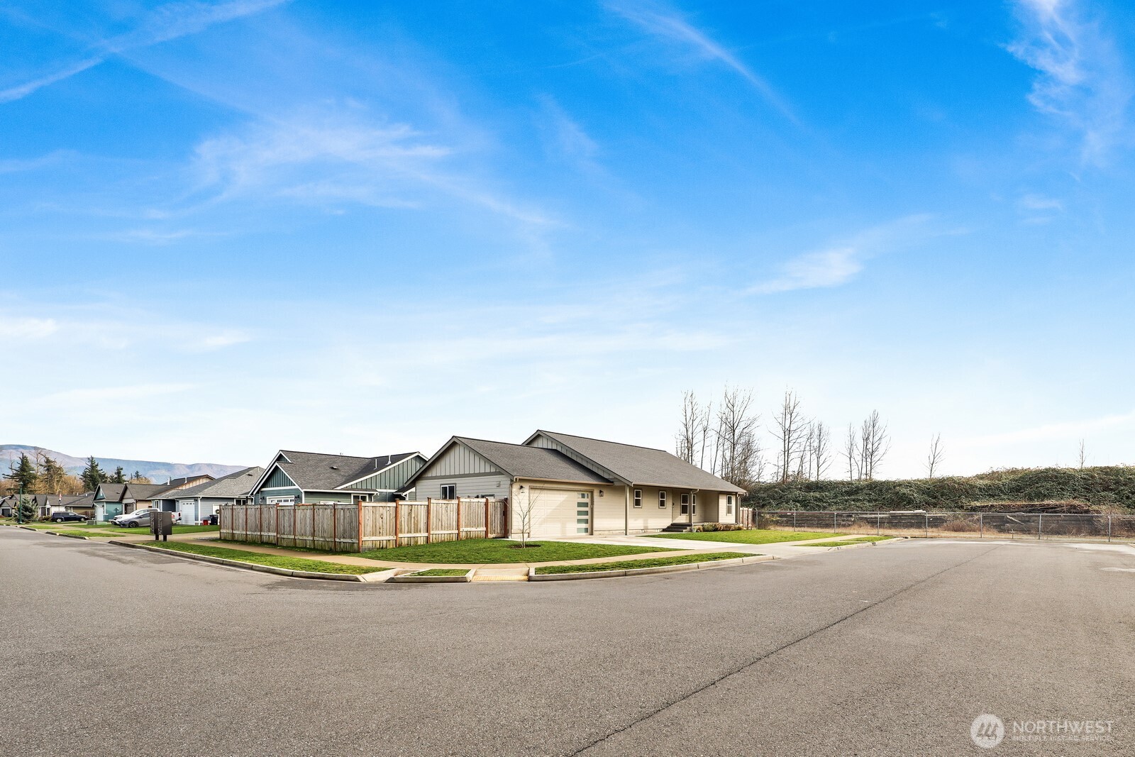1302 Night Hawk Way Everson, WA 98247 - Photo 2 of 35 a front view of a house with a yard and lake view