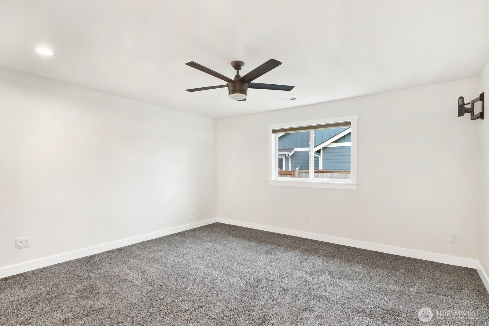 1302 Night Hawk Way Everson, WA 98247 - Photo 23 of 35 an empty room with a window and a fan