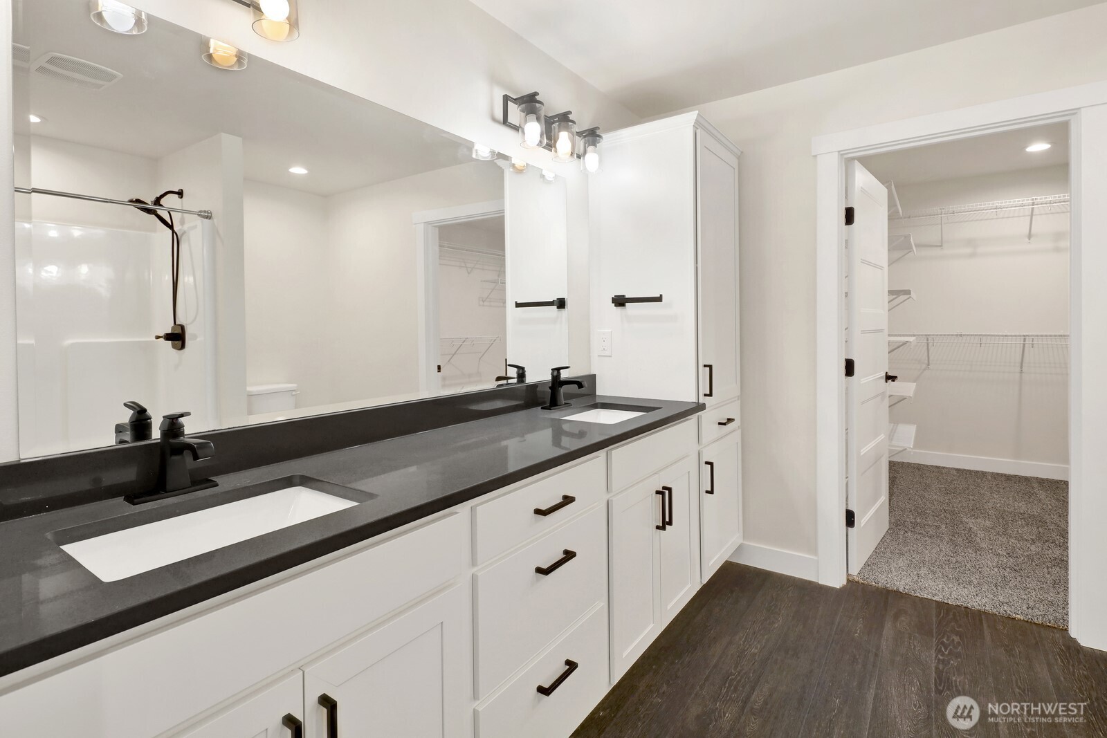 1302 Night Hawk Way Everson, WA 98247 - Photo 25 of 35 a large bathroom with a granite countertop sink a large mirror and shower