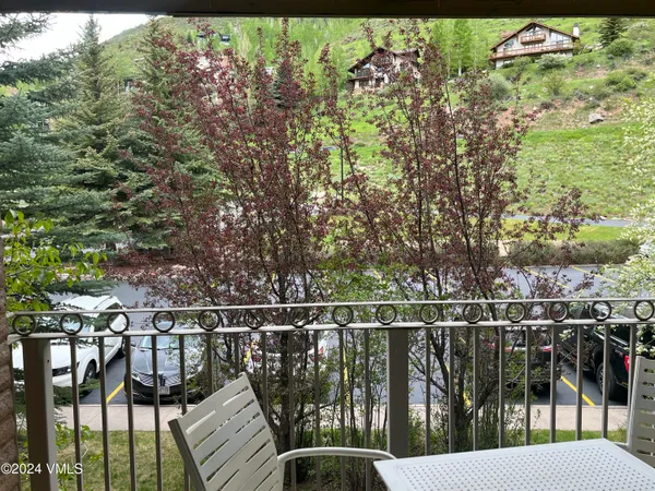 a balcony with chairs