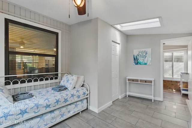 a view of a livingroom with furniture and windows