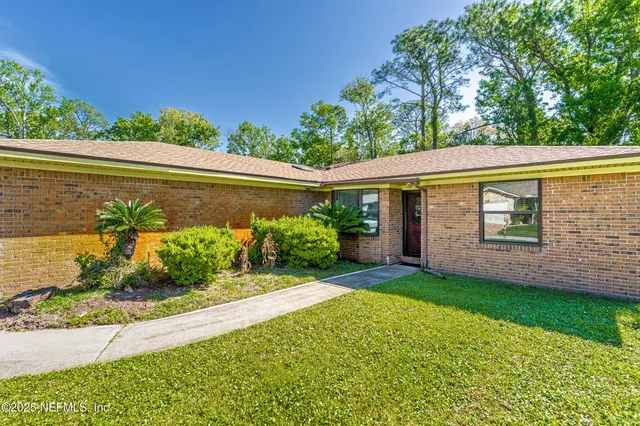 a view of a house with garden