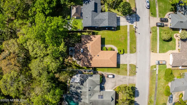 an aerial view of a house with a garden