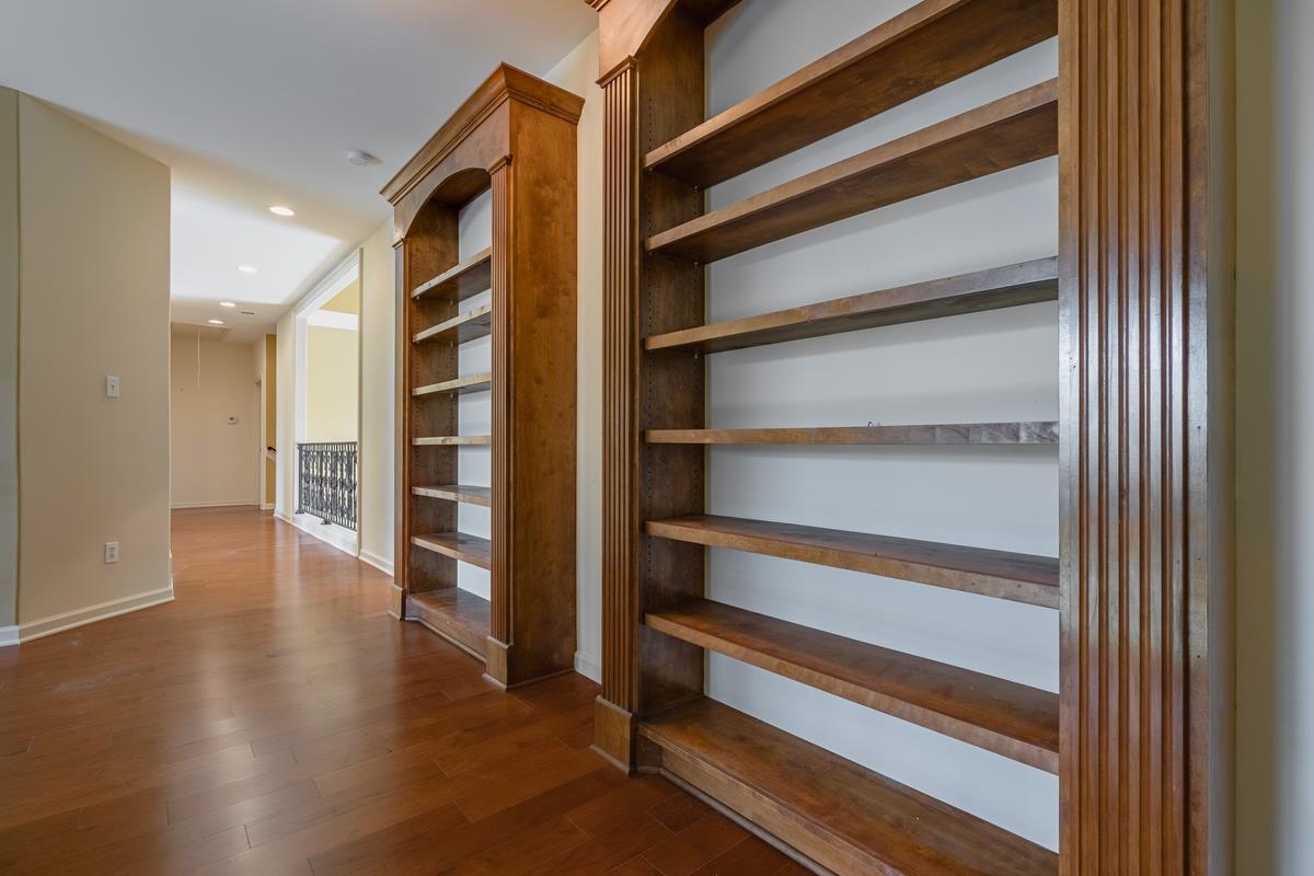 8250 Deadfall Road Millington, TN 38053 - Photo 21 of 26 a view of an empty room with wooden floor and a window