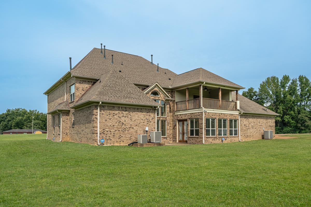 8250 Deadfall Road Millington, TN 38053 - Photo 26 of 26 front view of a house with a yard