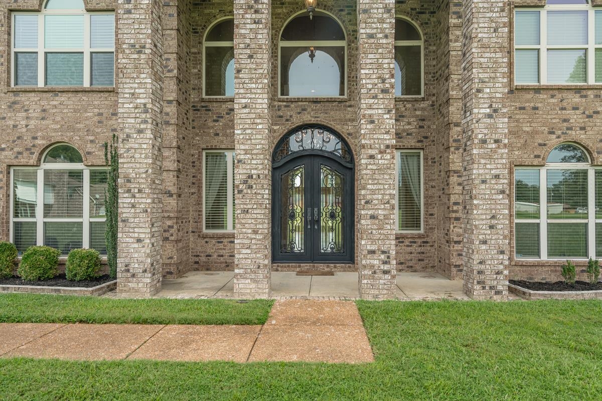 8250 Deadfall Road Millington, TN 38053 - Photo 3 of 26 a front view of a house with garden