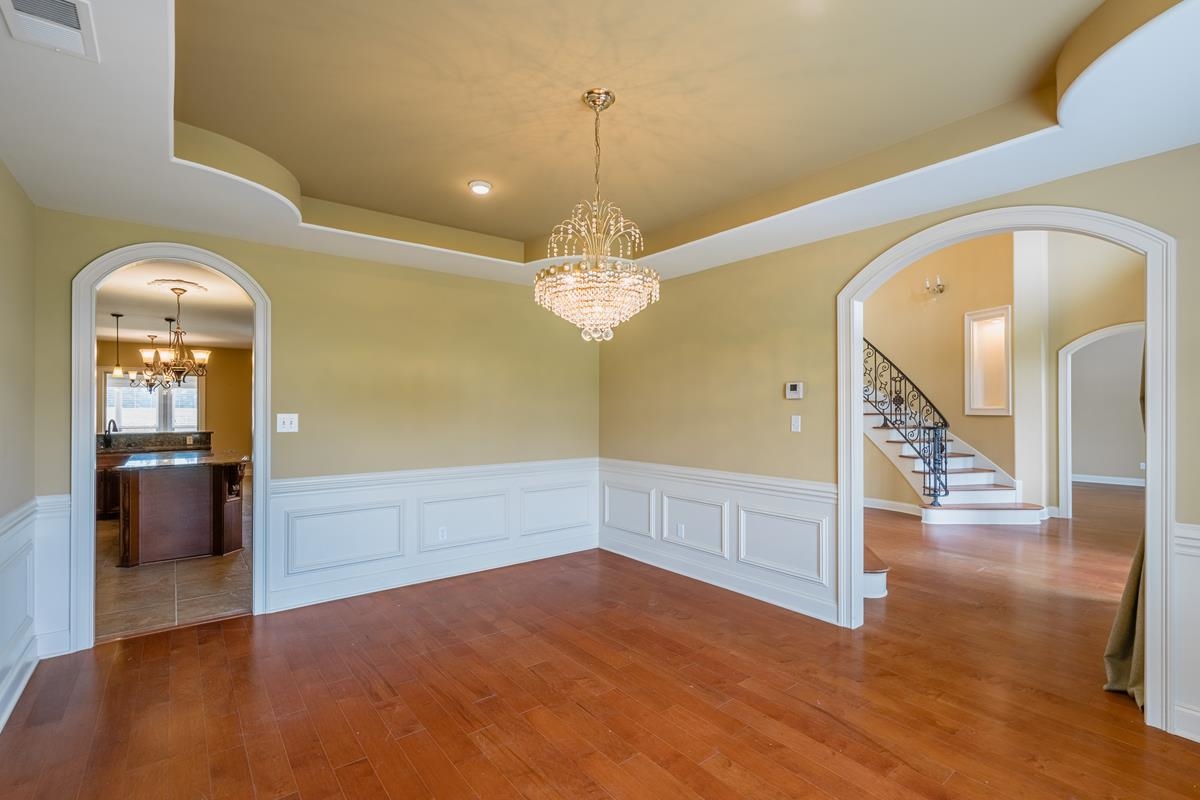 8250 Deadfall Road Millington, TN 38053 - Photo 10 of 26 a view of a livingroom with wooden floor and a chandelier