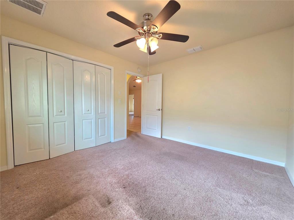 4284 High Ridge Avenue Spring Hill, FL 34609 - Photo 30 of 40 a view of an empty room and a ceiling fan