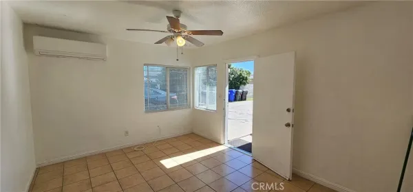 a view of room with window and hardwood floor