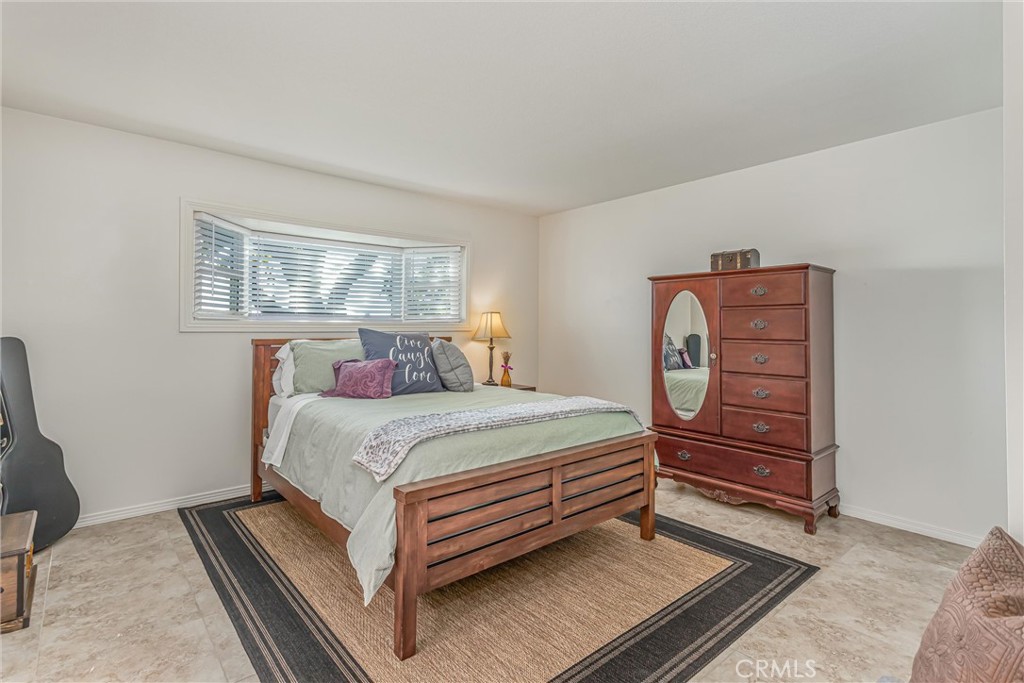 8651 Holly Street Rancho Cucamonga, CA 91701 - Photo 15 of 29 a bed room with a bed and a window