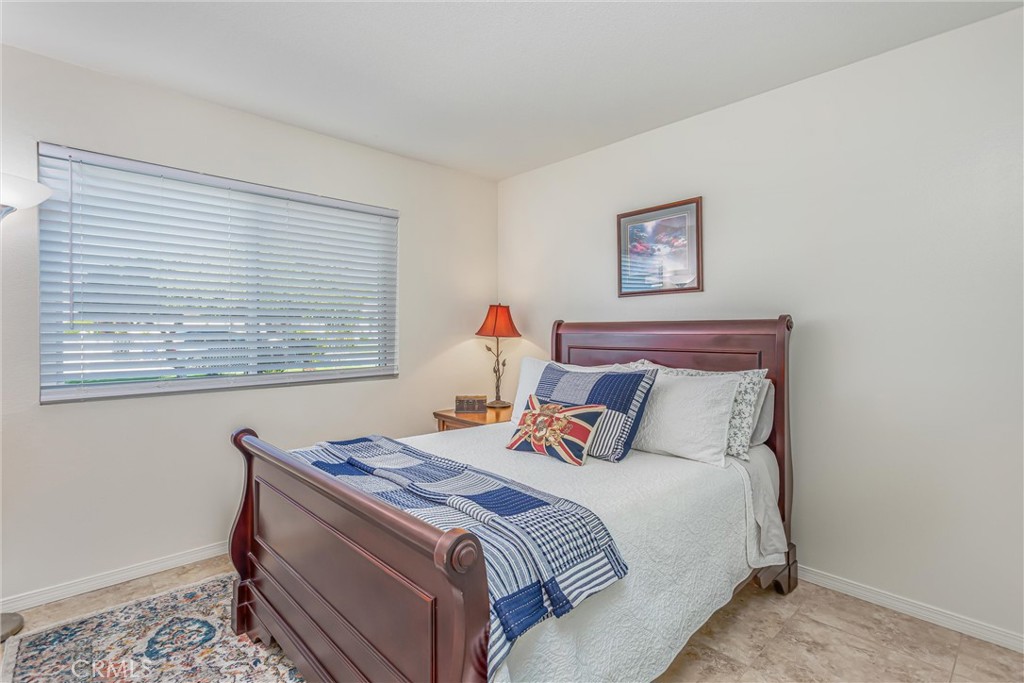 8651 Holly Street Rancho Cucamonga, CA 91701 - Photo 18 of 29 a bedroom with a bed and a window