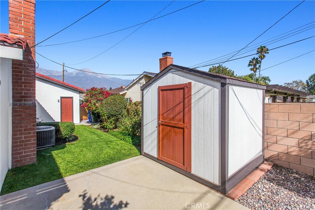8651 Holly Street Rancho Cucamonga, CA 91701 - Photo 20 of 29 a front view of a house with a yard