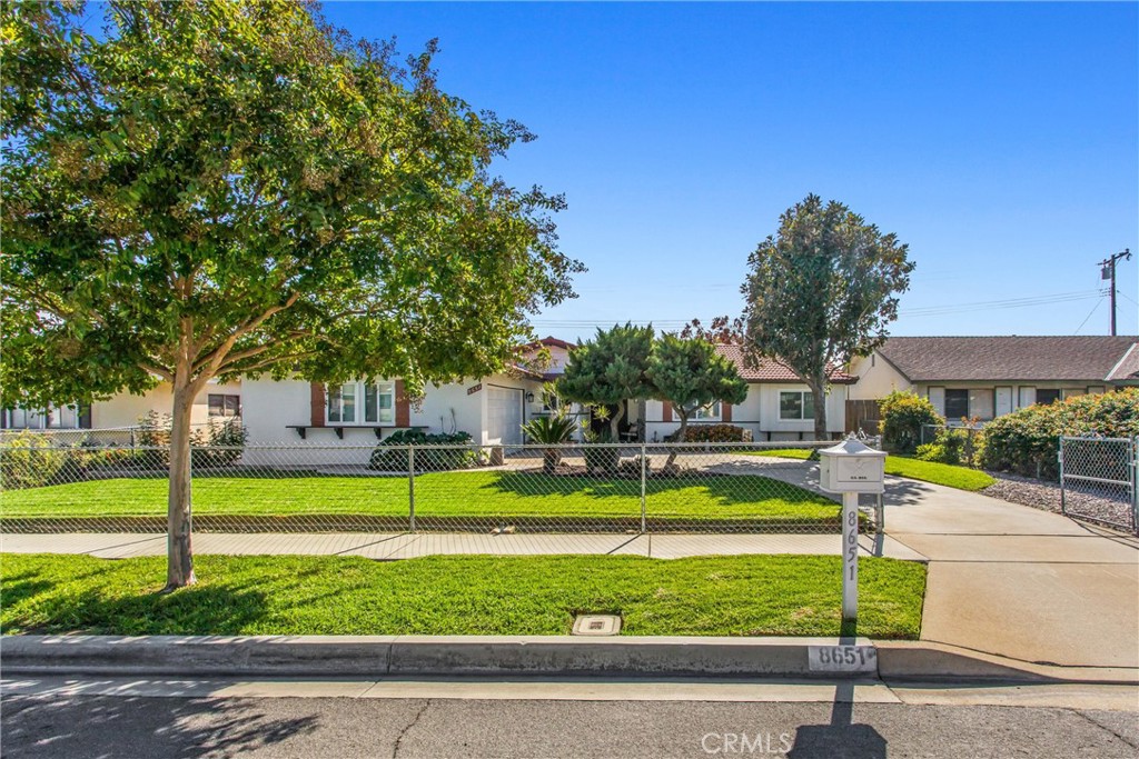 8651 Holly Street Rancho Cucamonga, CA 91701 - Photo 26 of 29 a view of a house with swimming pool and a yard