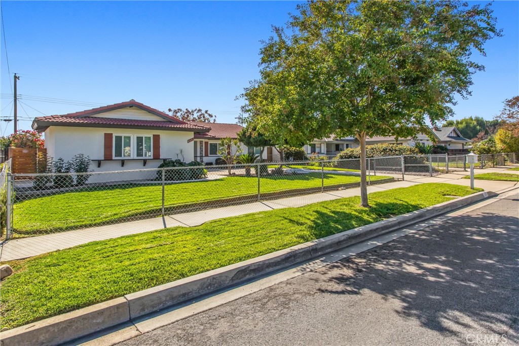 8651 Holly Street Rancho Cucamonga, CA 91701 - Photo 27 of 29 a view of a house with swimming pool and yard