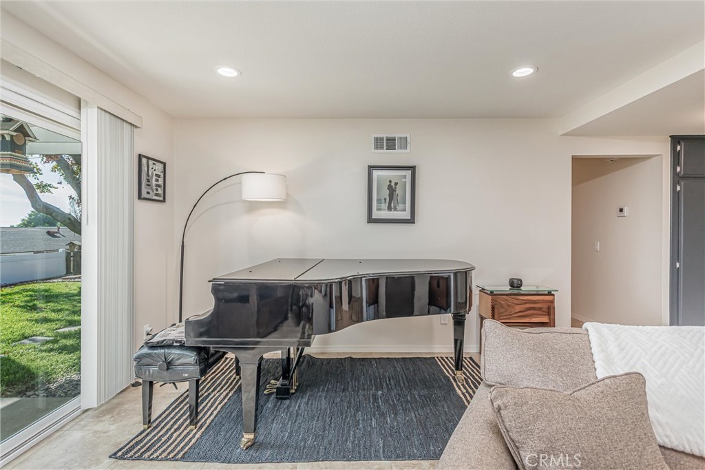8651 Holly Street Rancho Cucamonga, CA 91701 - Photo 5 of 29 a living room with furniture and a window