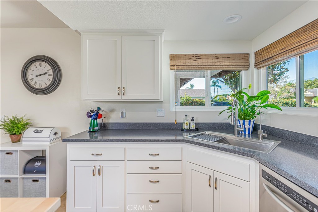 8651 Holly Street Rancho Cucamonga, CA 91701 - Photo 8 of 29 a kitchen with appliances cabinets and a large window