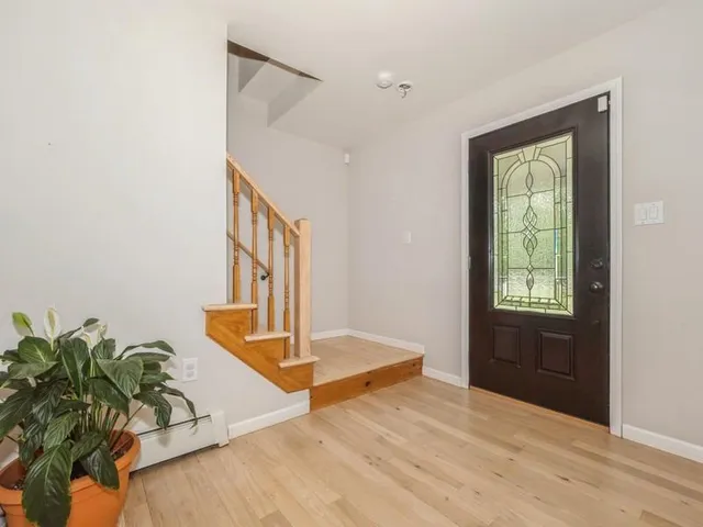 a view of entryway with wooden floor