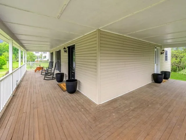 a view of swimming pool with seating space