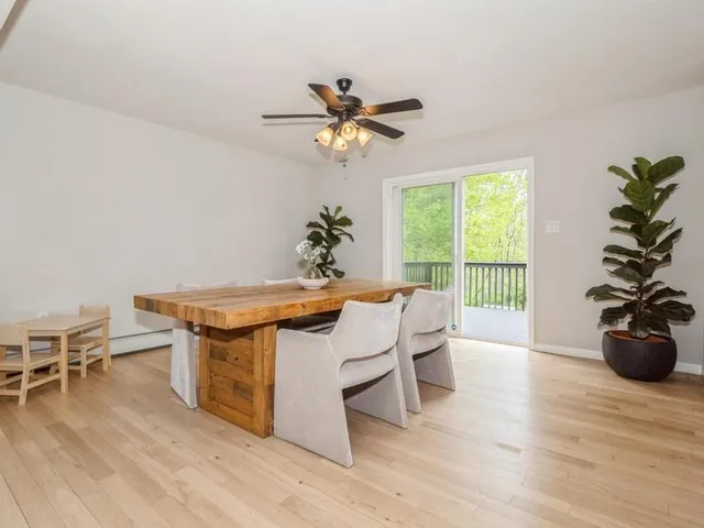 a view of a livingroom with furniture and a potted plant