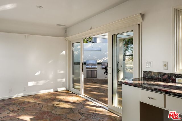a view of a bathroom with a tub and shower