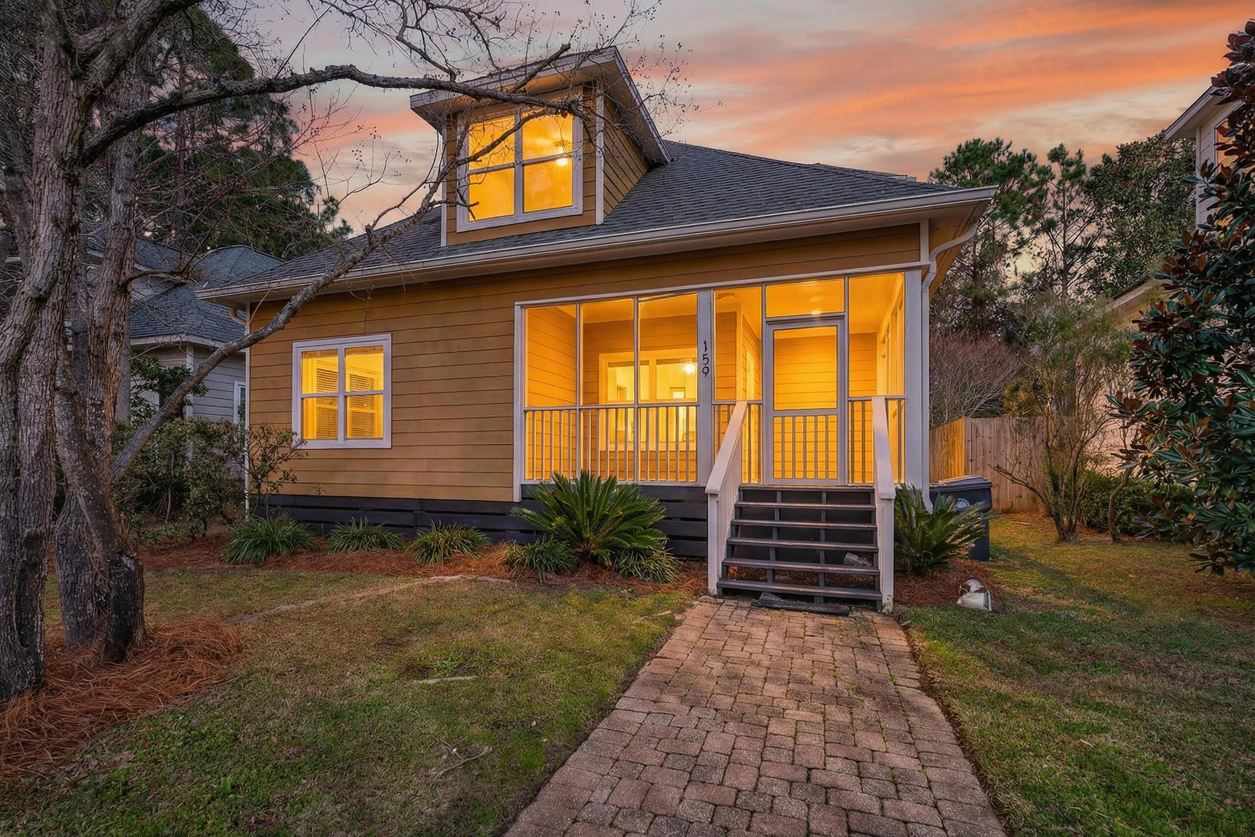 159 7th Street Santa Rosa Beach, FL 32459 - Photo 16 of 53 a front view of a house with garden