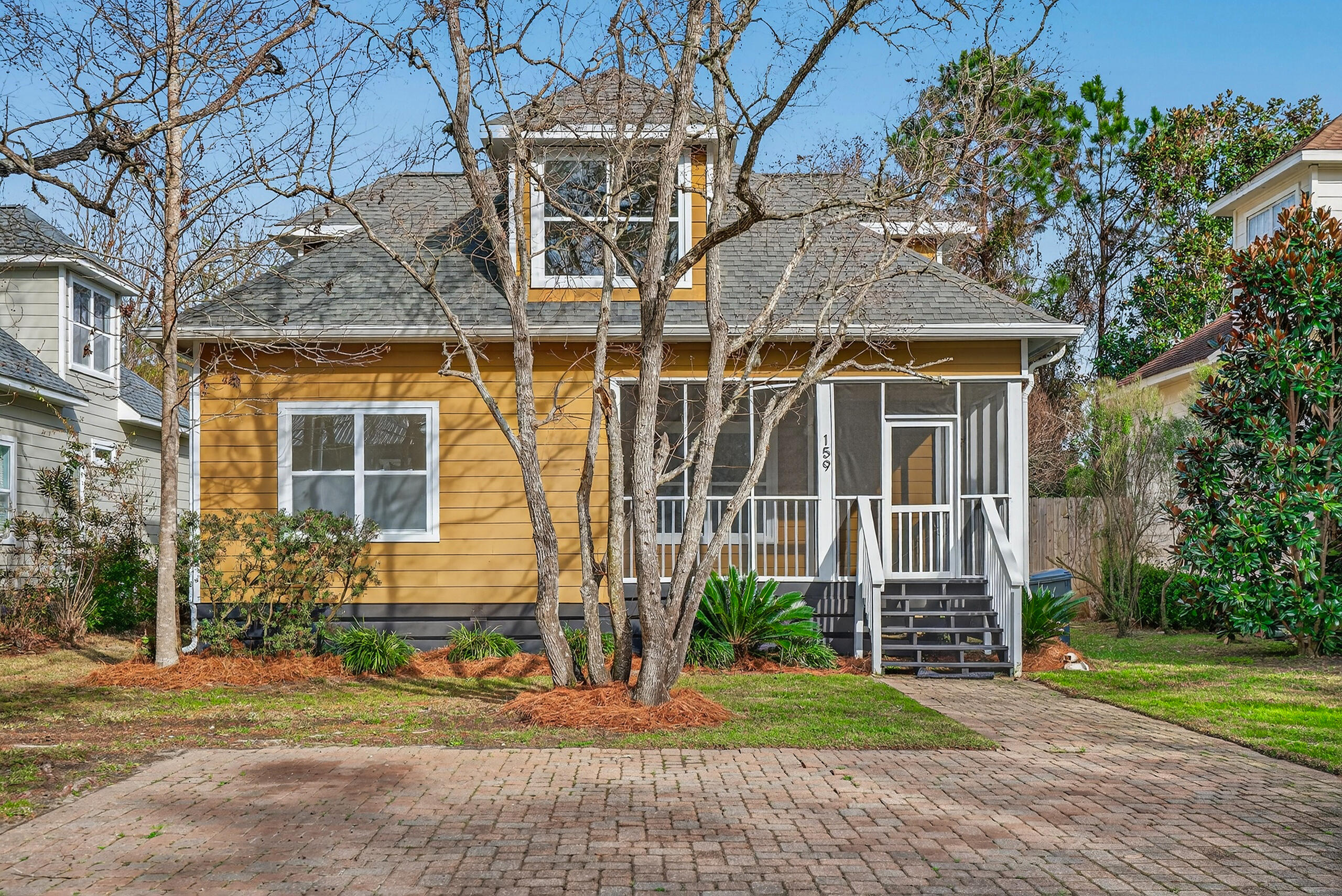 159 7th Street Santa Rosa Beach, FL 32459 - Photo 2 of 53 a front view of a house with garden