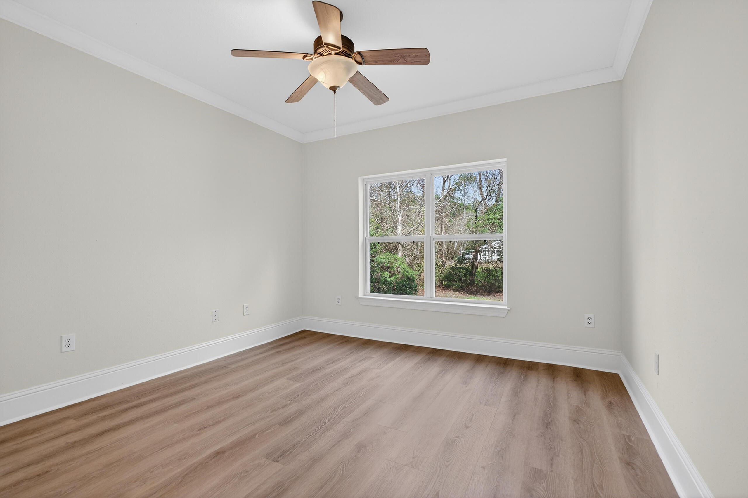159 7th Street Santa Rosa Beach, FL 32459 - Photo 21 of 53 wooden floor in an empty room with a window