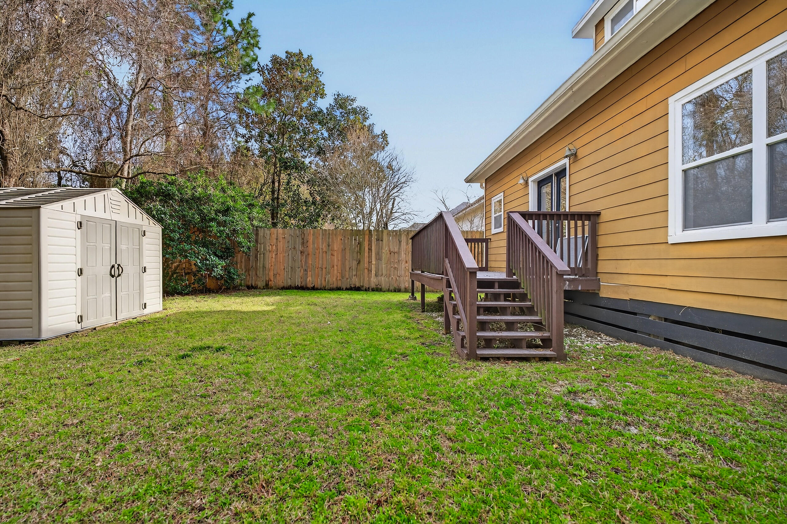 159 7th Street Santa Rosa Beach, FL 32459 - Photo 50 of 53 a view of a house with a back yard and a wooden deck