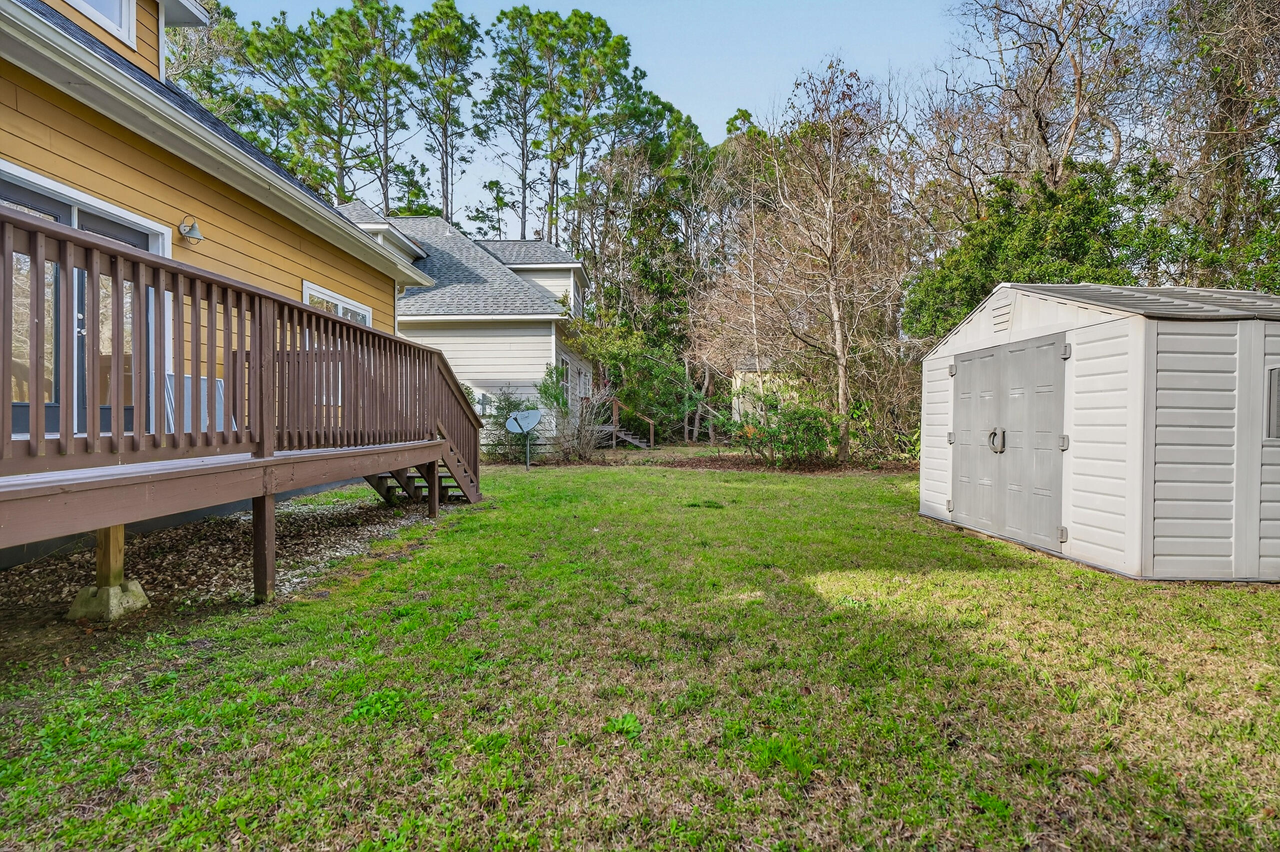 159 7th Street Santa Rosa Beach, FL 32459 - Photo 51 of 53 a view of backyard with small cabin and wooden fence