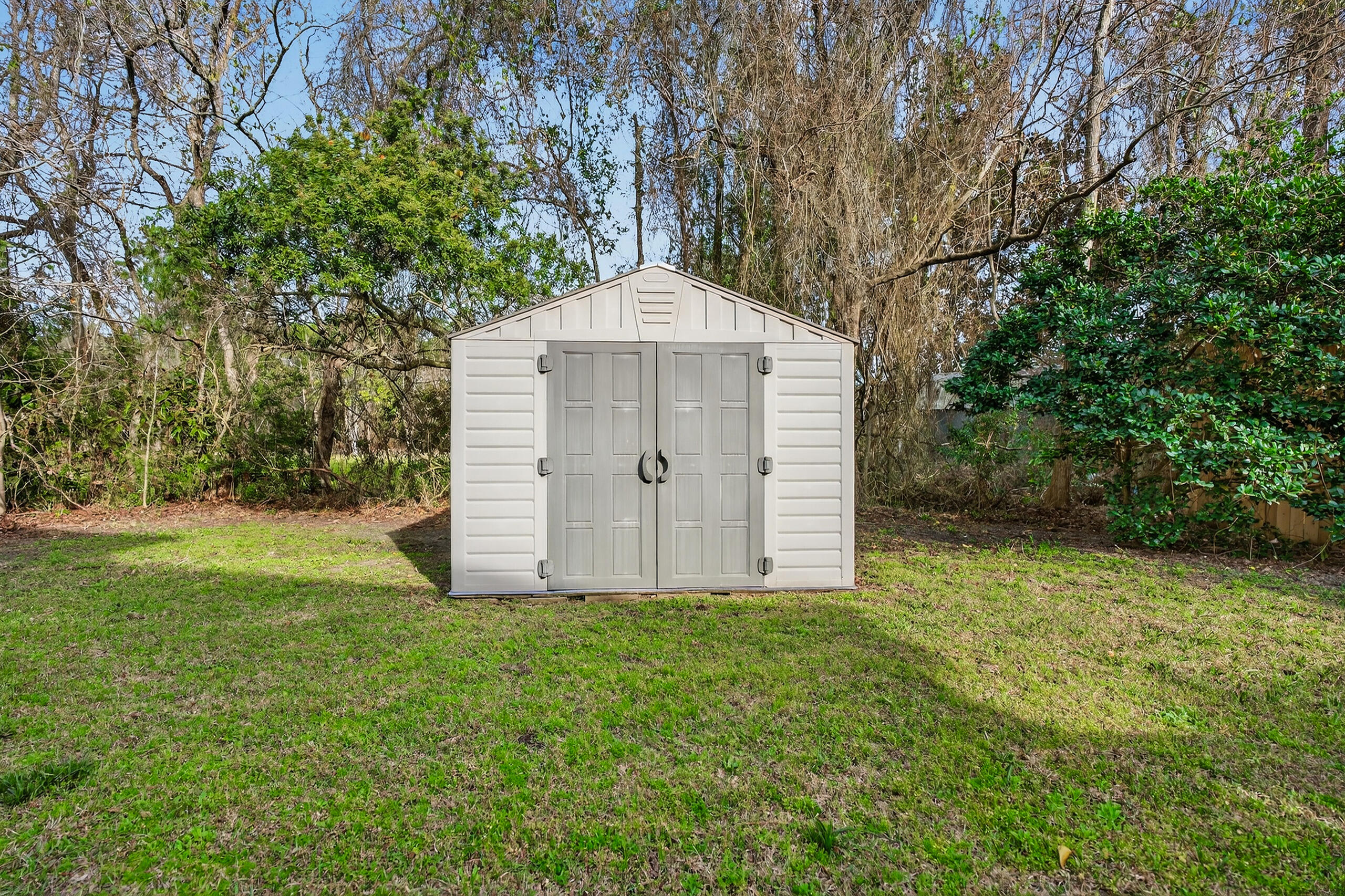 159 7th Street Santa Rosa Beach, FL 32459 - Photo 52 of 53 a view of a house with a yard and large trees